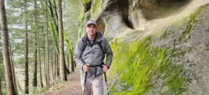 Andy hiking along a path